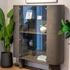Erice wine storage cabinet featuring a transparent glass door for easy viewing and elegant presentation.