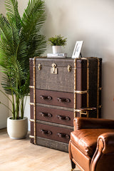 Hereford highboy cabinet with vintage leather trunk design, three drawers and flip-top storage compartment