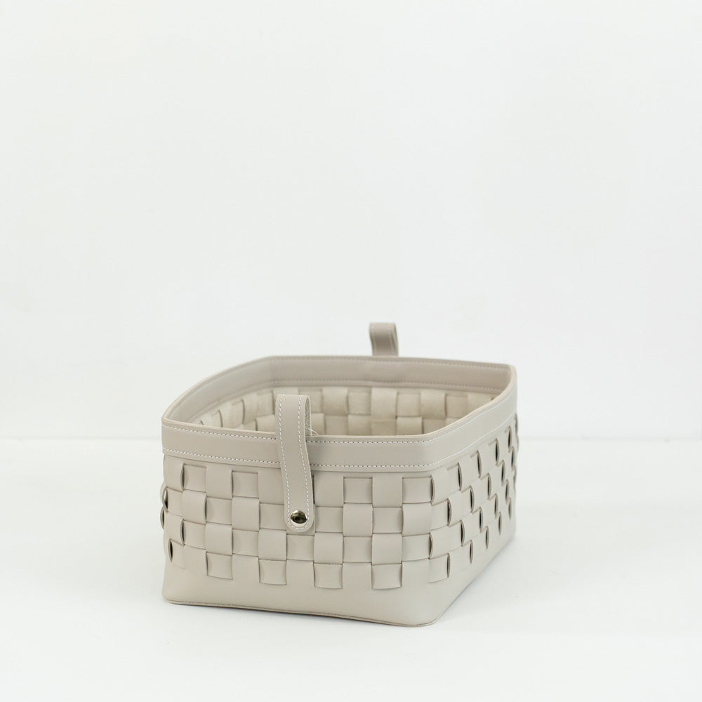 Close-up of Kara hand-woven bridle leather storage basket showing fine leather texture and craftsmanship