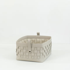 Close-up of Kara hand-woven bridle leather storage basket showing fine leather texture and craftsmanship