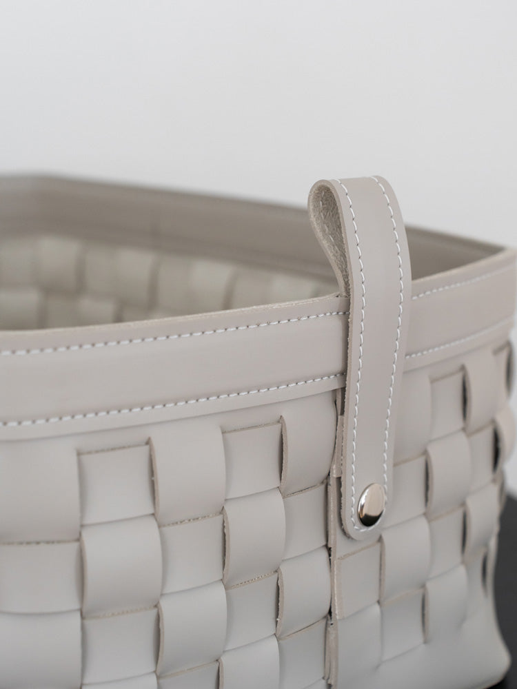 Luxurious brown bridle leather storage basket featuring hand-woven craftsmanship, ideal for organizing magazines, throws, or accessories in modern and Scandinavian interiors.