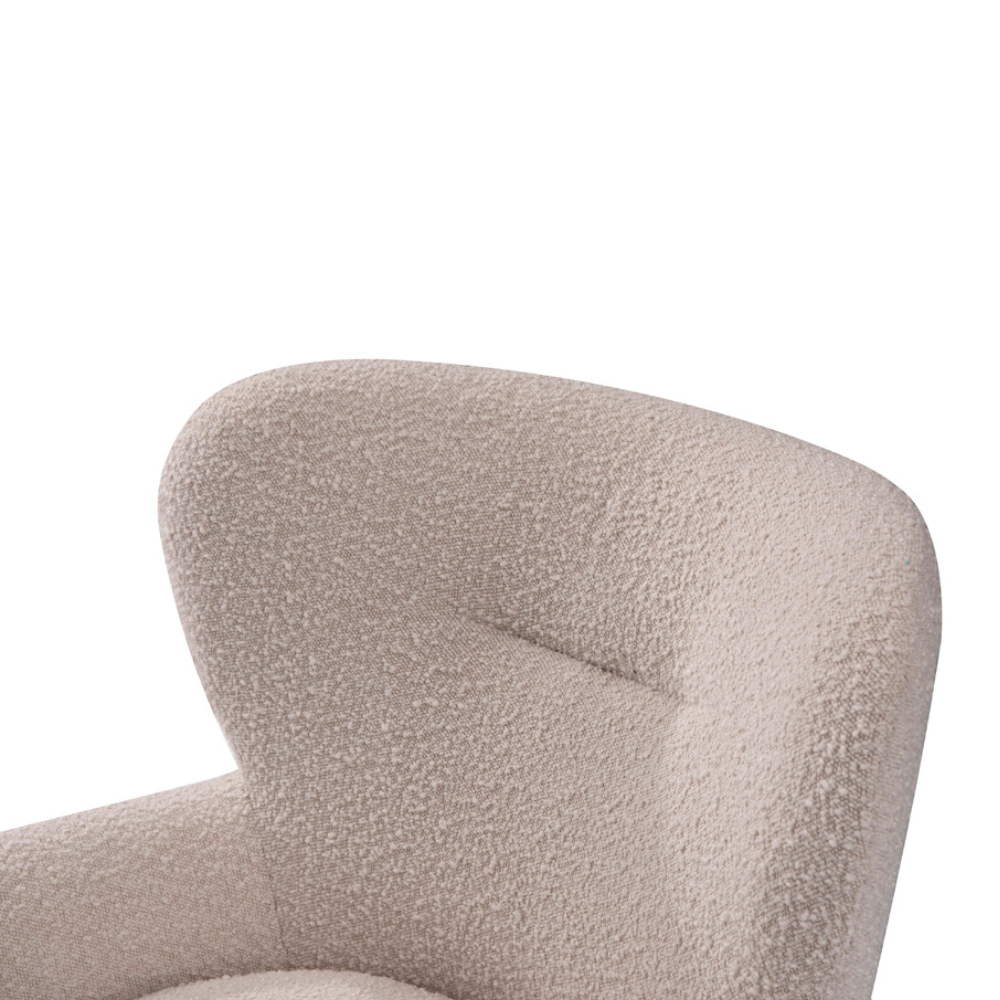 Designer Lecce Bouclé Armchair styled in a cozy bedroom reading corner, showcasing soft fabric, deep seating, and inviting curved lines