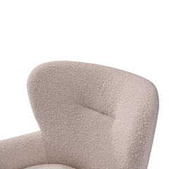 Designer Lecce Bouclé Armchair styled in a cozy bedroom reading corner, showcasing soft fabric, deep seating, and inviting curved lines