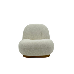 Modern white bouclé accent chair with curved silhouette and metal  base