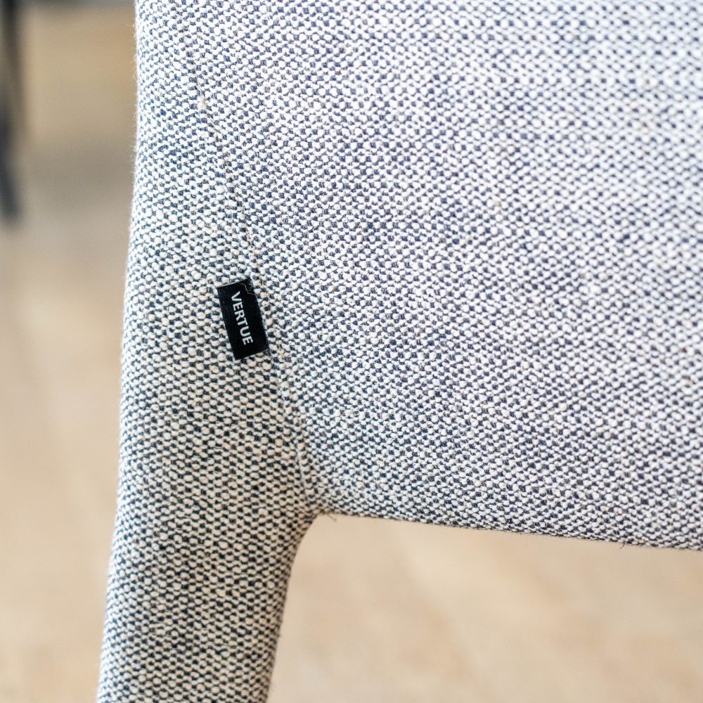 Contemporary Lulea Armchair in cotton blend upholstery, versatile modern accent chair for home or lounge spaces.