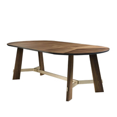 Lulea timber dining table with detailed veneer top, gold-accented base, and decorative gold bolts, styled in a modern dining room.