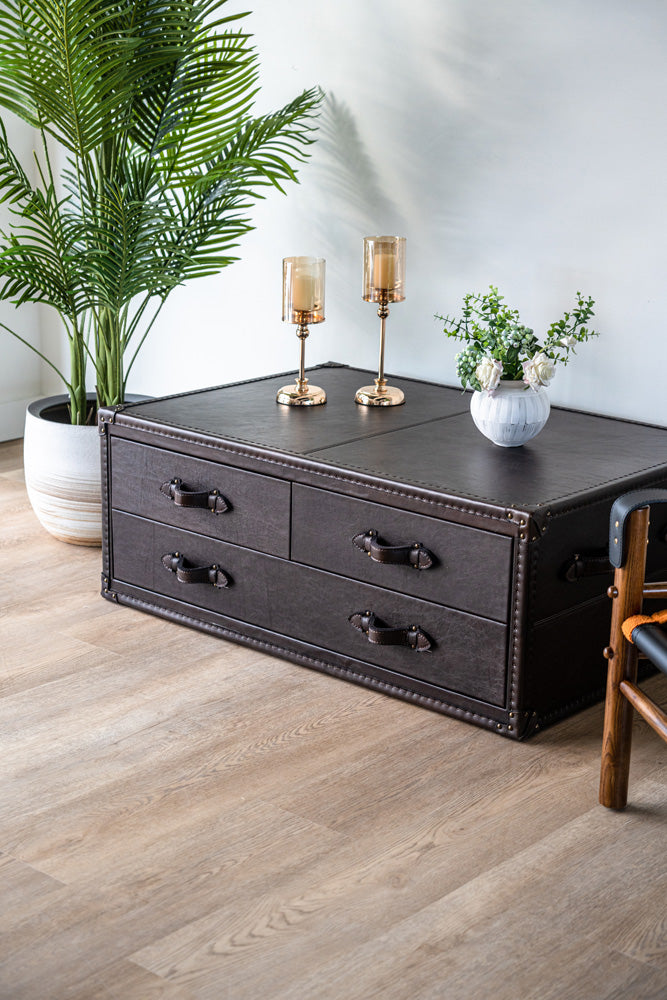 Luxury Felix coffee table in top grain leather, featuring spacious drawers and trunk-inspired design details