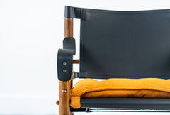 Mid-century modern Yorkshire lounge chair crafted with ashwood frame and leather details, stylish designer chair
