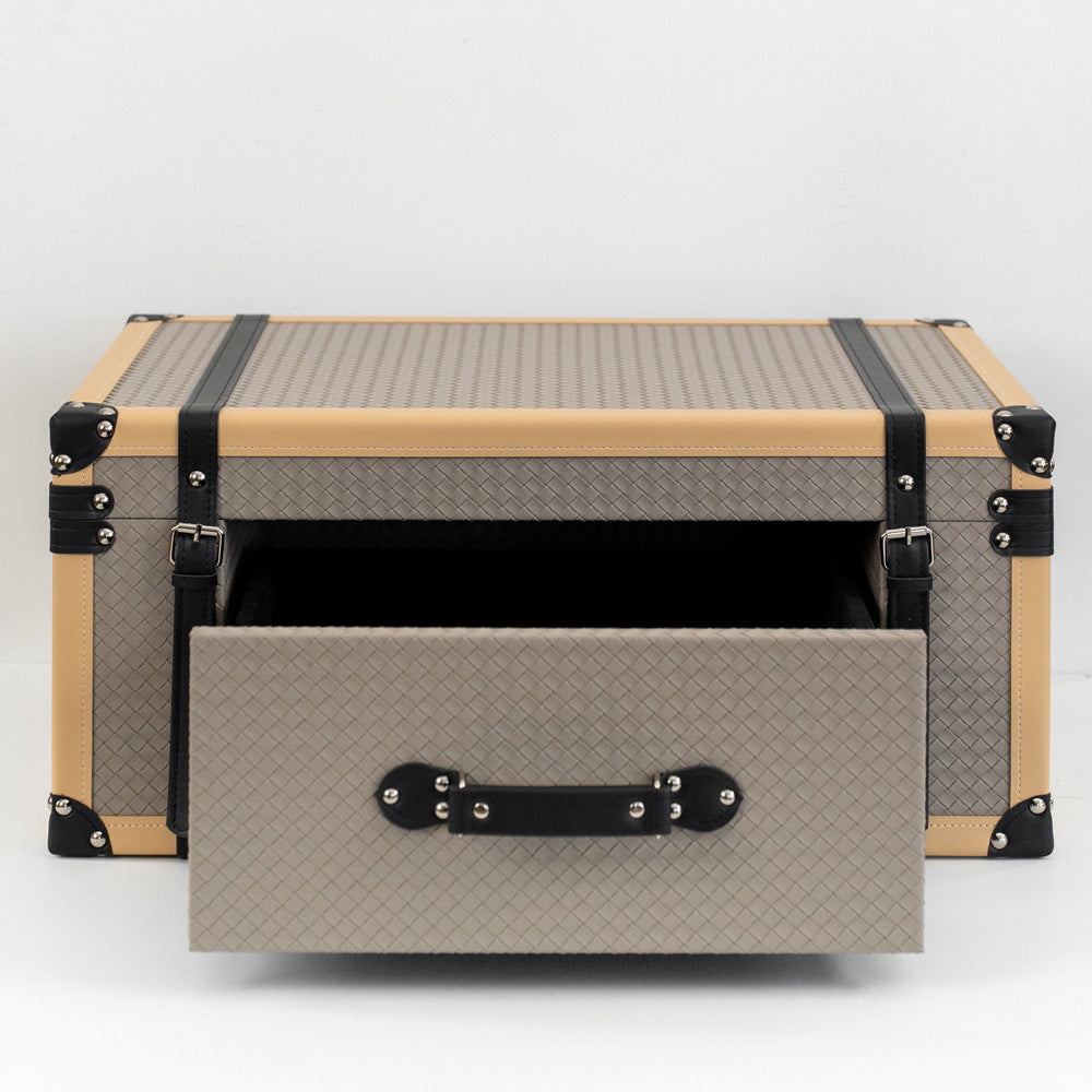 Milo storage box with front drawer open, containing jewelry and watches on a mid-century modern vanity.
