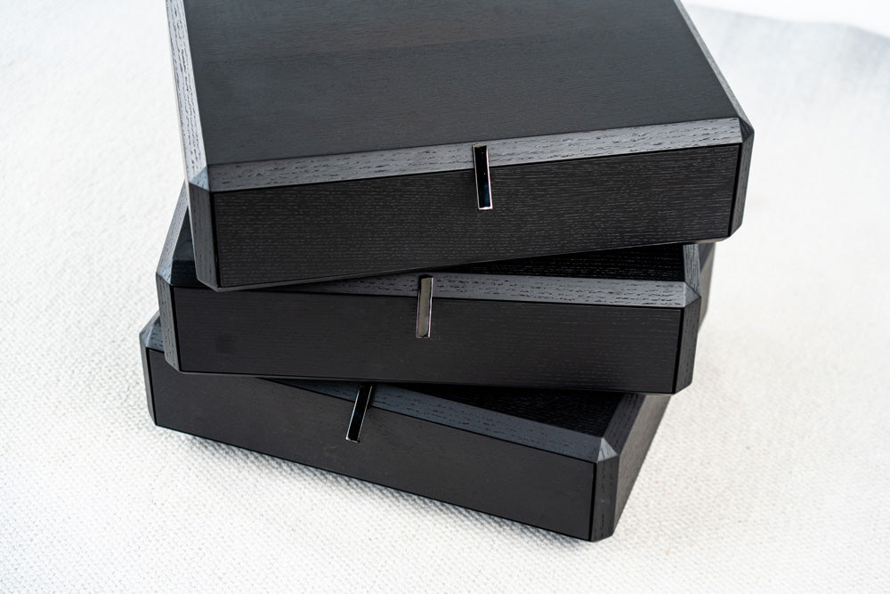 Modern rotating bedside table with black wood finish and swivel drawers, stylish bedroom furniture