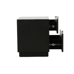 Nefe Bedside Table functioning as a nightstand in a modern bedroom setup with neutral-toned bedding and wall art