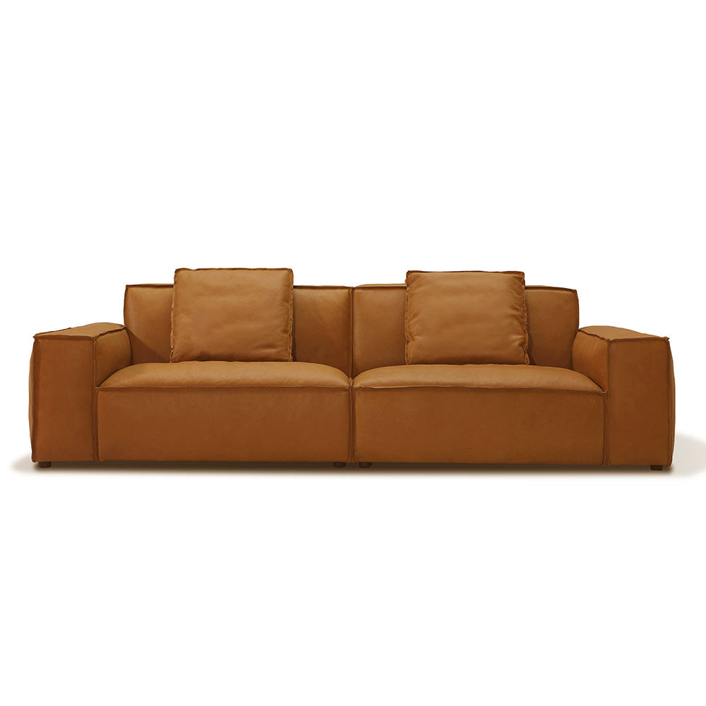 Nora 3 Seater Sofa in premium Brazilian top grain leather with subtle distressed finish, modern low-profile design, luxury comfort with extra back cushions
