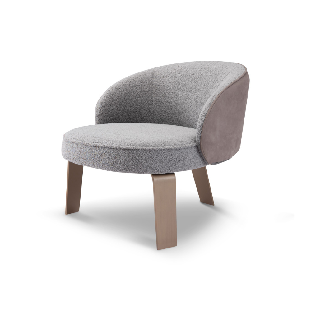 Designer Orvieto Accent Chair with sculptural curves, brass-toned legs, and tactile bouclé upholstery — inspired by Art Deco and mid-century modern aesthetics.