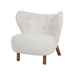 Oslo luxury accent armchair in teddy fabric with exaggerated wingback, button detailing, wooden legs, cozy designer armchair for living room or bedroom.