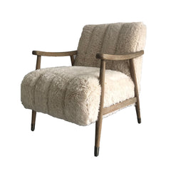 Rauma Chair upholstered in lambswool fabric with washed oak frame, light natural tones, and nickel-capped legs, modern country style.