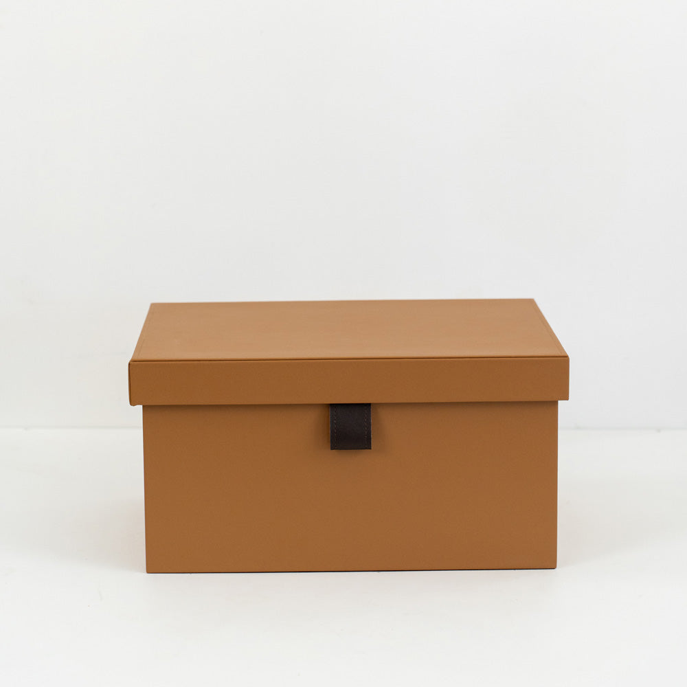 Small, medium, and large Ross PU leather storage boxes with velvet lining displayed in a minimalist modern room