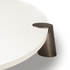 Santoro Round Modern Coffee Table featuring a sculptural design, cracked lacquer effect top, and minimalist metal base — ideal for contemporary or art-inspired interiors.