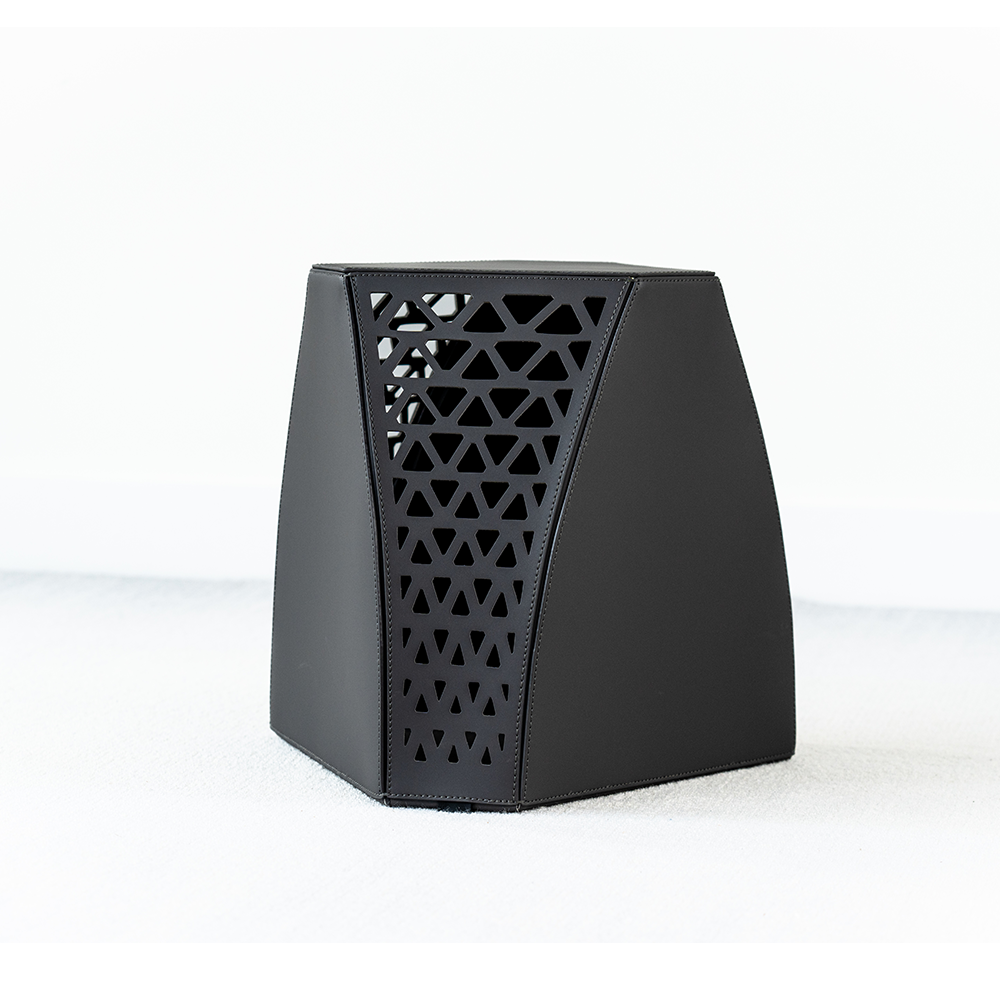 Seggio Stool featuring a geometric carbon steel frame and premium saddle leather seat, styled in a modern kitchen setting
