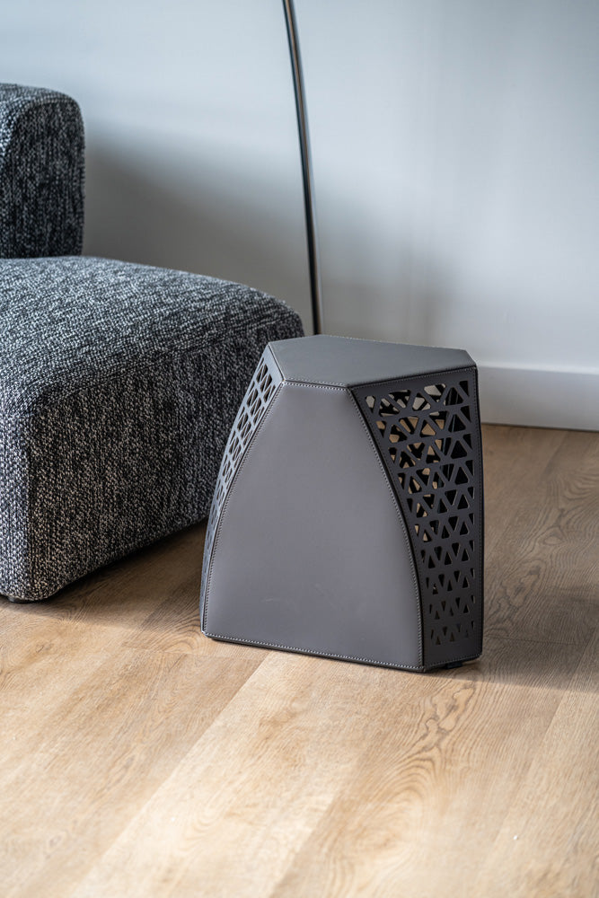 View of the Seggio Stool’s carbon steel legs with openwork design, highlighting structural integrity and visual appeal