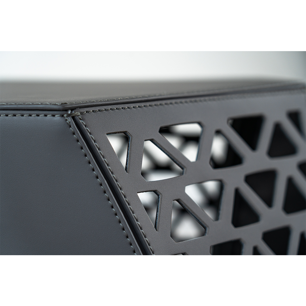 Modern Seggio Stool with premium saddle leather seat and geometric carbon steel frame, styled in a contemporary living space