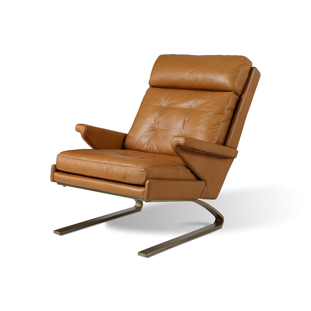 Skara luxury armchair in premium Brazilian top grain leather with hand-stitched detailing, bronze metal legs, subtle rocking design, designer accent chair
