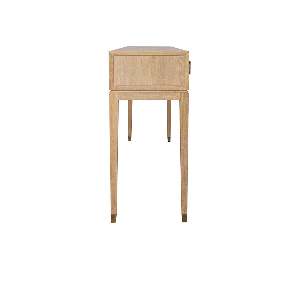 Sol natural oak console table styled in a living room with a table lamp and decorative vase
