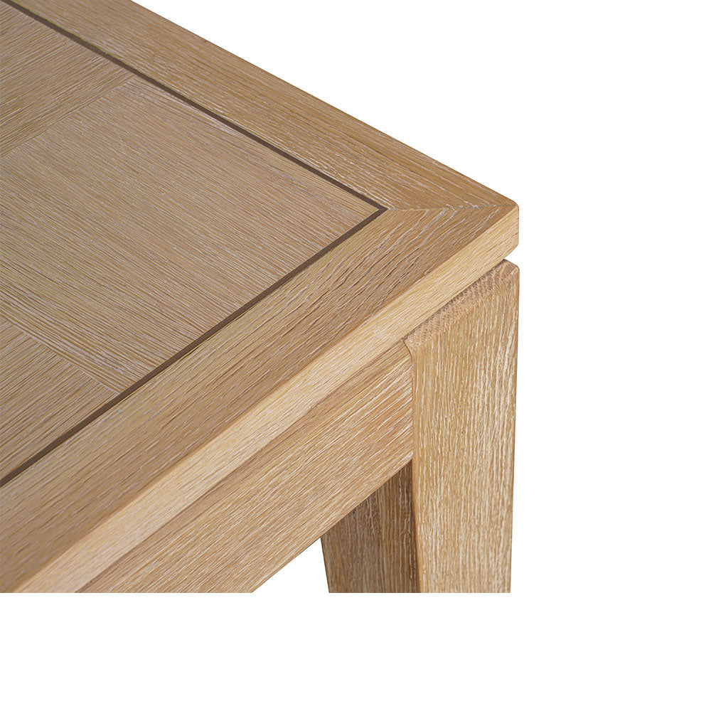 Sol modern wooden dining table featuring a solid yellow ash wood frame and oak veneer tabletop