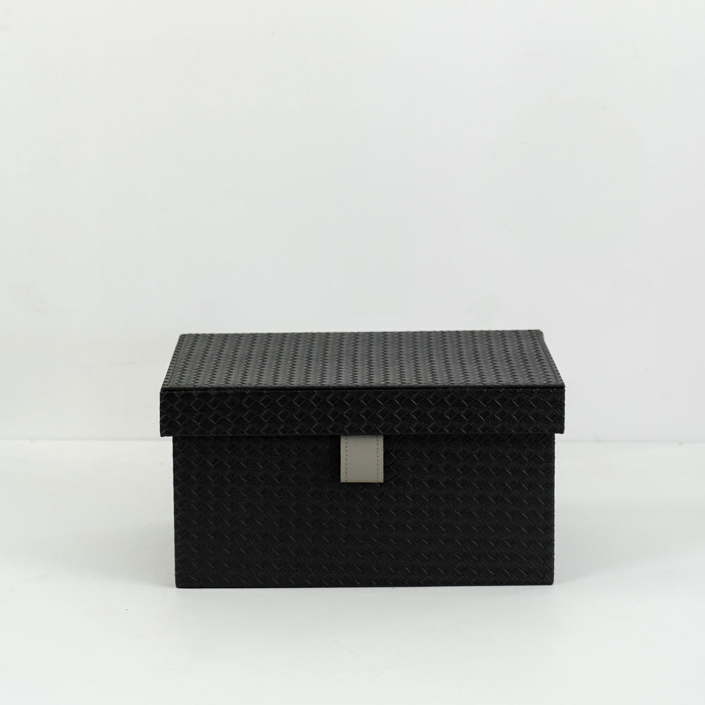 Sutton storage box holding jewelry and accessories, placed on a modern vanity table