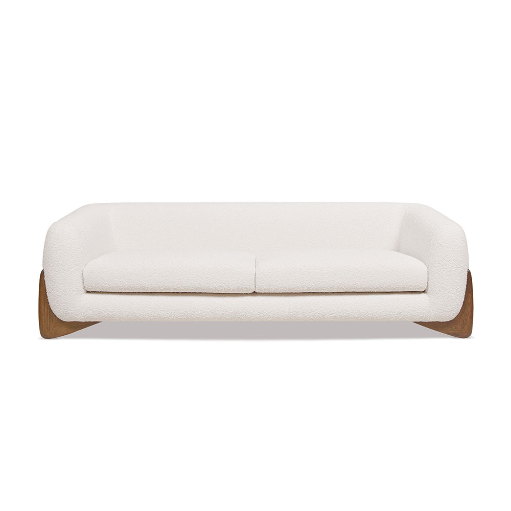 Tampere 3-Seater Sofa upholstered in boucle fabric with solid oak frame and artistically carved wooden legs.