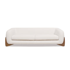 Tampere 3-Seater Sofa upholstered in boucle fabric with solid oak frame and artistically carved wooden legs.