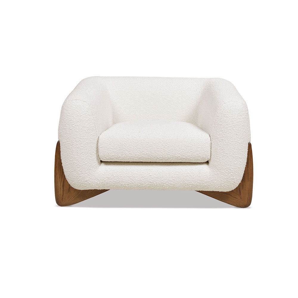 Tampere Armchair upholstered in boucle fabric with timber frame and carved solid oak legs.