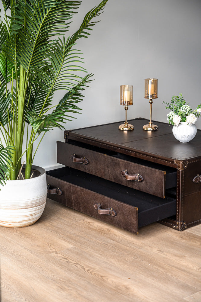 Felix coffee table upholstered in premium top-grain leather, featuring hidden storage compartments and vintage charm