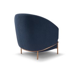 Vero Barrel-Shaped Bouclé Armchair featuring elegant curves, soft textured upholstery, and sleek brass legs — a bold statement piece for modern interiors.