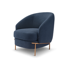 Luxury Vero Bouclé Armchair in rich navy fabric, showcasing a deep cushioned seat and graceful curves that enhance any modern living room décor.