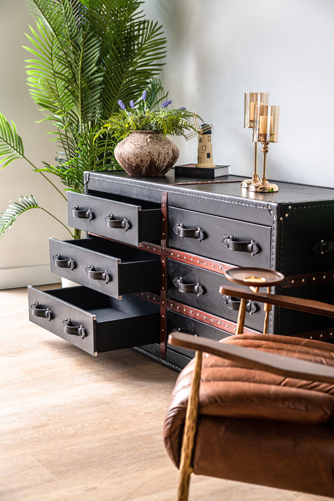 Wells dresser combining leather surface with wooden edge strips, chest of drawers offering bedroom storage and style
