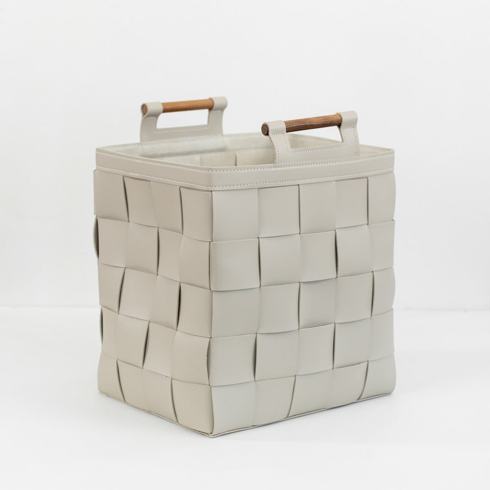 Zola hand-woven bridle leather basket used as decorative storage in a luxury home office or entryway